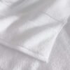 samifyhome-white-cotton-towel-texture-detail.jpg Close-up showing the soft plush texture and hem stitching of a Samifyhome cotton towel